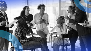 Talent strategy image of a large group of young people talking and laughing together in a collaborative atmosphere