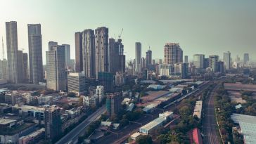 An aerial view of the Mumbai financial district featuring several skyscrapers.