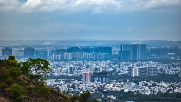 A skyline view of Pune, Maharashtra taken from a hillside.